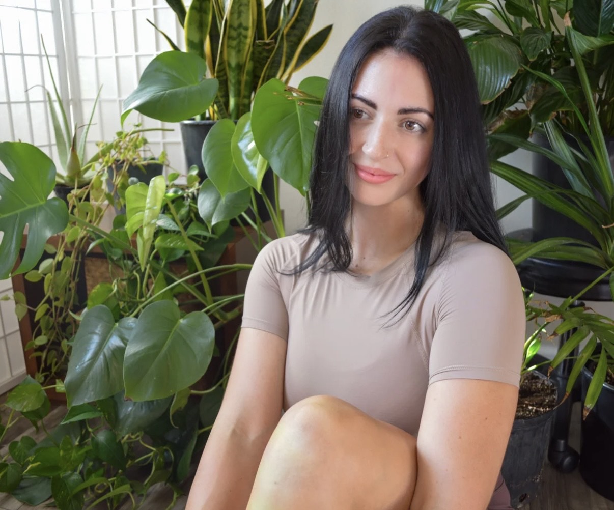 Image shows a woman smiling.